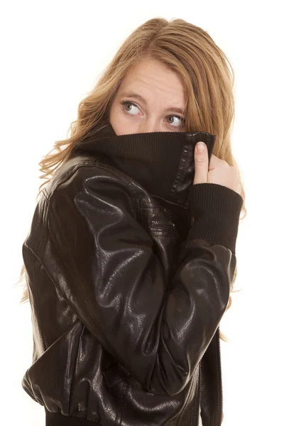 Woman leather peek back behind jacket — Stock Photo, Image