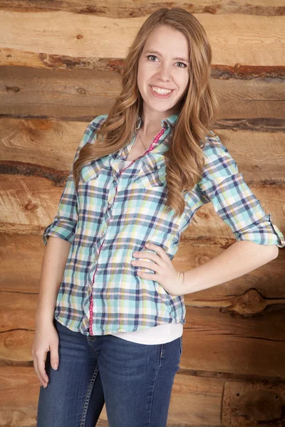 Woma plaid shirt on wood background smile — Stock Photo, Image