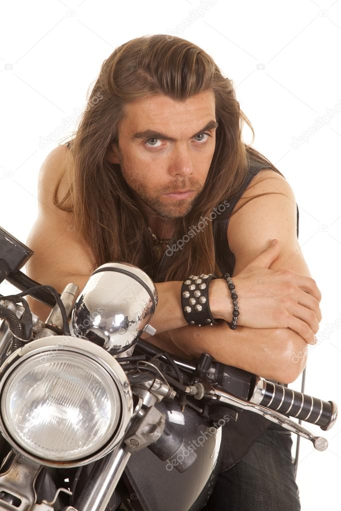 man lean forward on motorcycle