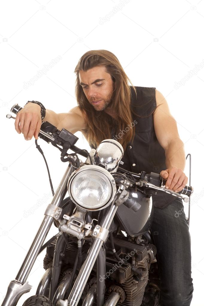 man leather vest motorcycle look down