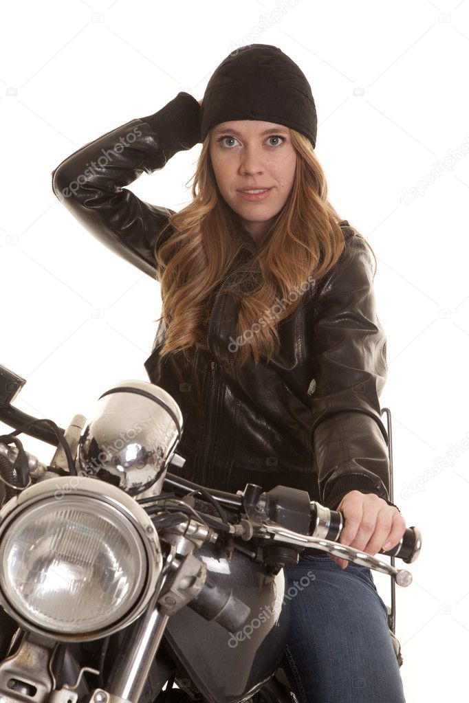 woman black leather motorcycle hand on hat