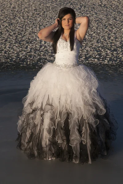 Woman formal dress ice stand hands hair — Stock Photo, Image