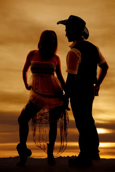 Silhouet vrouw rok omhoog man cowboy — Stockfoto