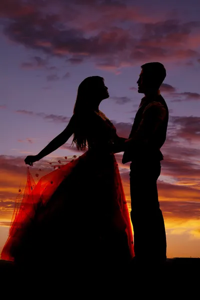 Siilhouette couple dancing hold skirt — Stock Photo, Image