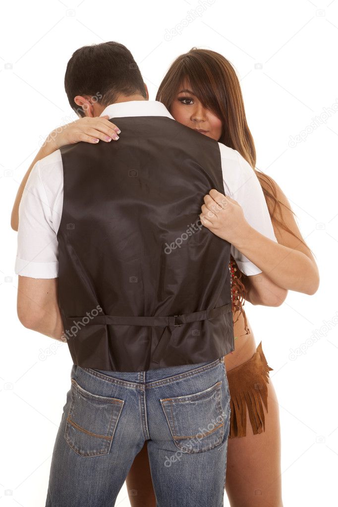 Cowboy and Indian woman look over his shoulder