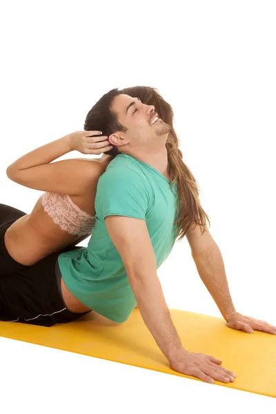 Fitness woman on mans back head back — Stock Photo, Image