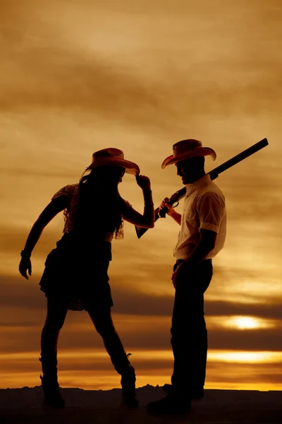 Silhouette cowboy cowgirl gun tip hat — Stock Photo, Image