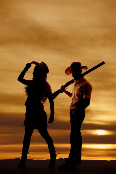 Silhouette cowboy cowgirl gun her look away — Stock Photo, Image