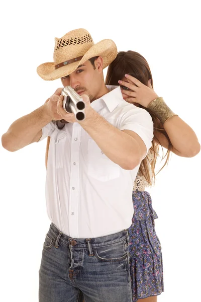 Woman behind cowboy with gun hide — Stock Photo, Image
