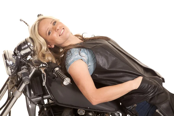 Woman leather lay back on motorcycle smile — Stock Photo, Image