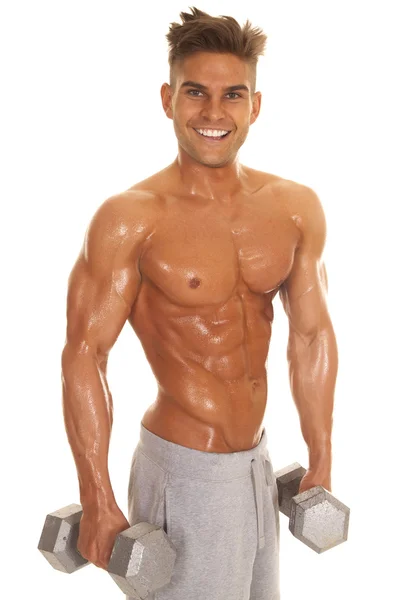 Man no shirt shiny weights stand smile — Stock Photo, Image