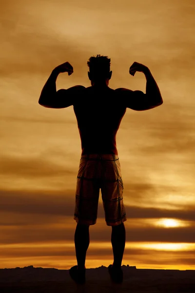 Silhouette wet man muscles flex both arms up — Stock Photo, Image