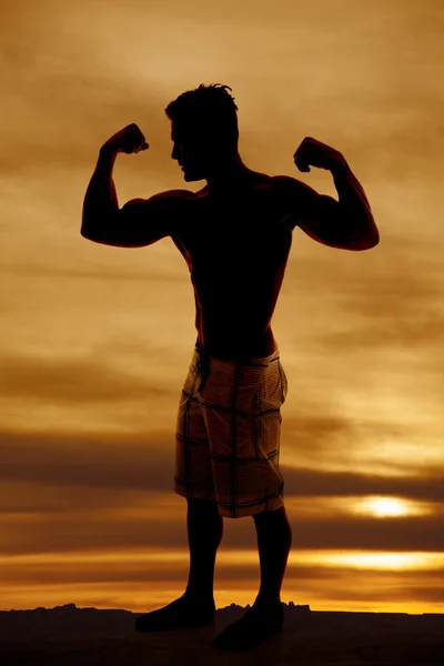 Silhouette wet man muscles standing flexing — Stock Photo, Image