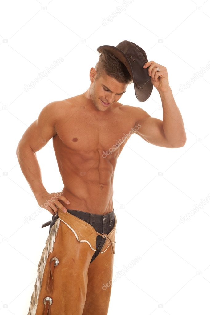 man no shirt chaps hat by head hand on hip