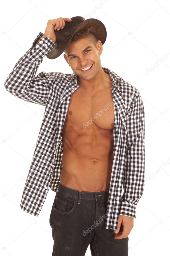 man with open shirt hold hat on head