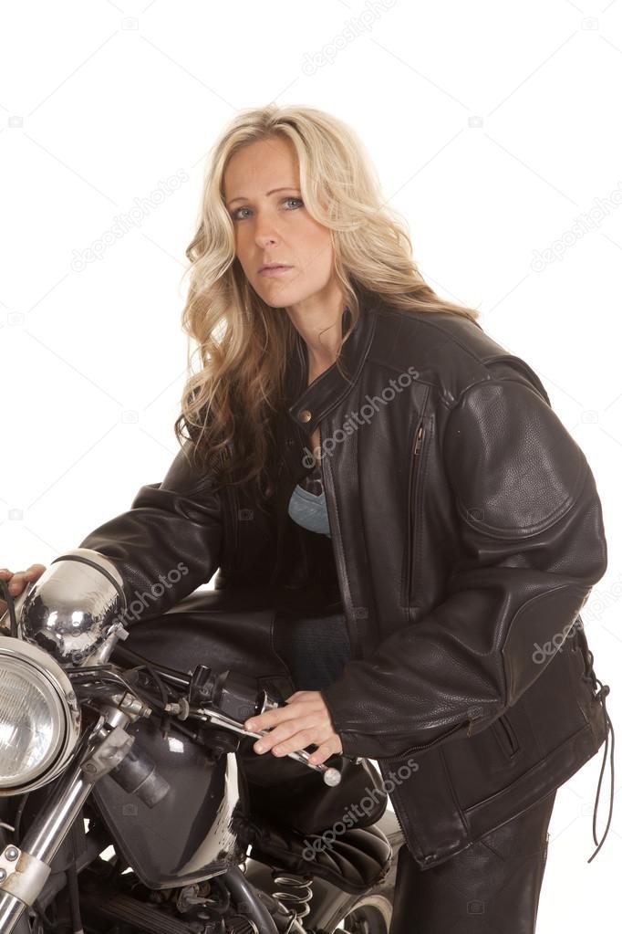 Woman leather sit on motorcycle jacket look