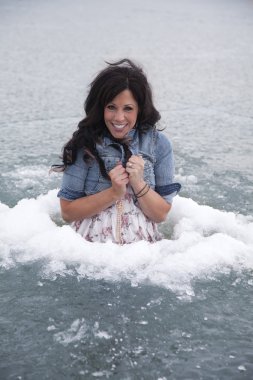 woman in ice hole smile cold