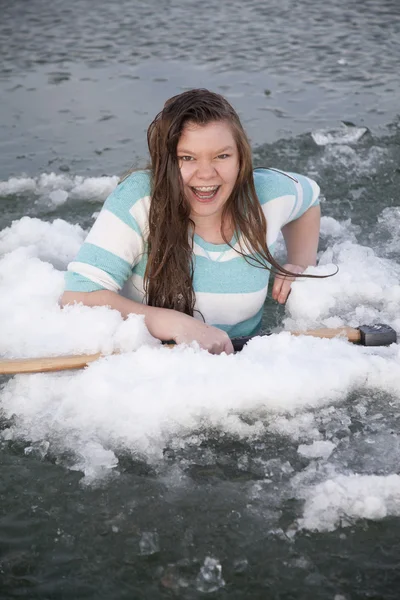 Gilr in ice hold with axe laughing — Stock Photo, Image