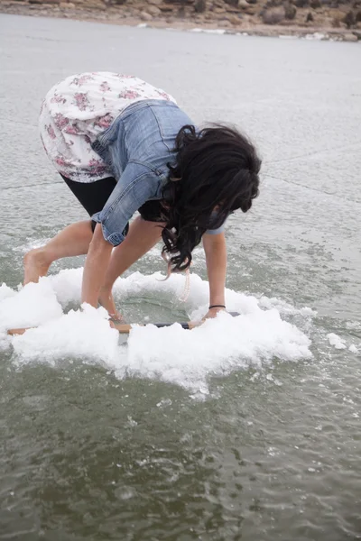 Woman climb in ice hole — Stock Photo, Image