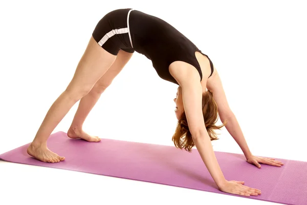 Latin woman fitness shorts downward dog — Stock Photo, Image