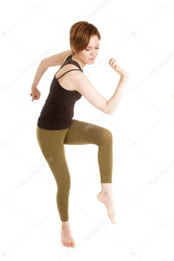 Latin woman green leggings dance leg up — Stock Photo © alanpoulson