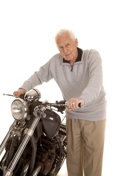Oudere man houden motorfiets Stuur — Stockfoto
