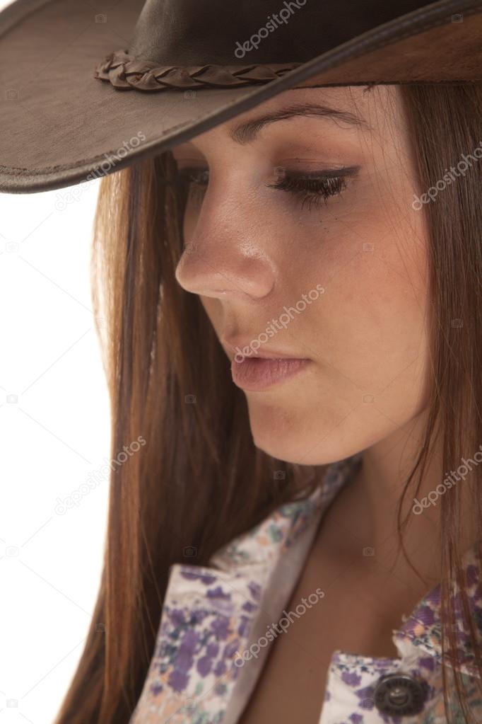 woman side close in hat look down