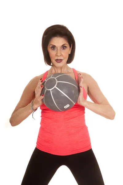 Older woman medicine ball in front — Stock Photo, Image