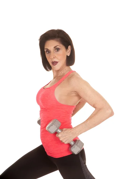 Older woman workout weights side look — Stock Photo, Image