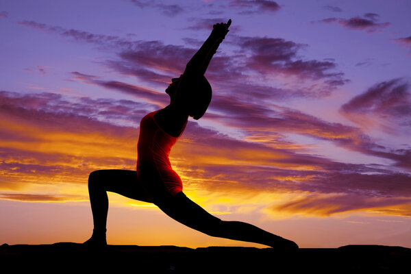 silhouette yoga woman lunge arms both up