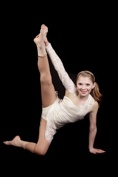 Young girl dance holding leg up — Stock Photo, Image