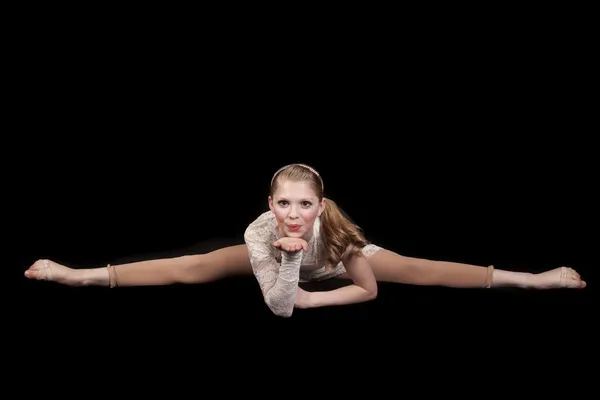 Young girl dance splits blow kiss — Stock Photo, Image