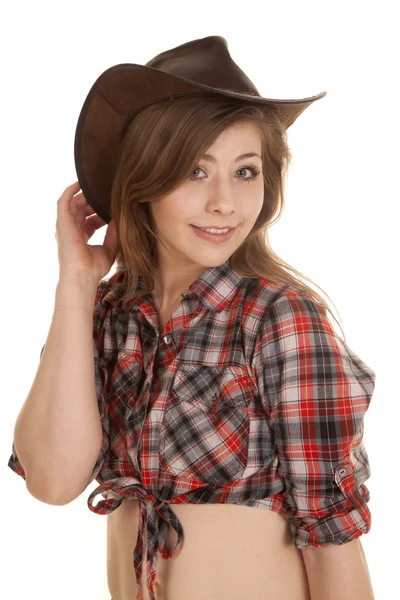 Cowgirl kapelusz koszula w kratę rękę za kapelusz — Zdjęcie stockowe