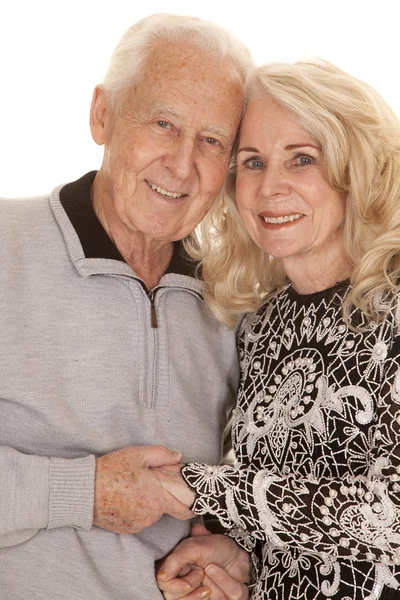 Elderly couple heads close hold hands — Stock Photo, Image