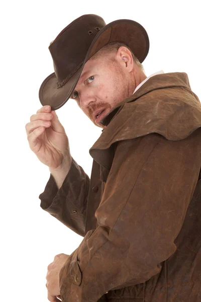 Cowboy espanador olhar para trás toque chapéu perto — Fotografia de Stock