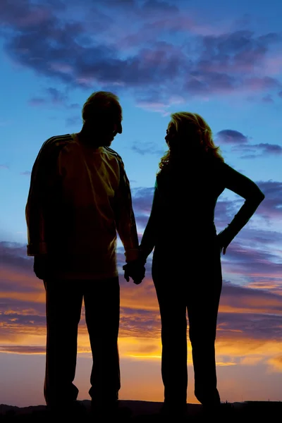 Silhouette elderly couple holding hands walk — Stock Photo, Image