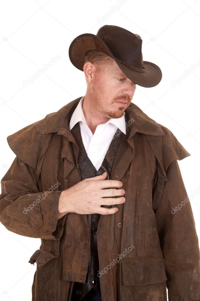 cowboy in hat and duster hand on heart