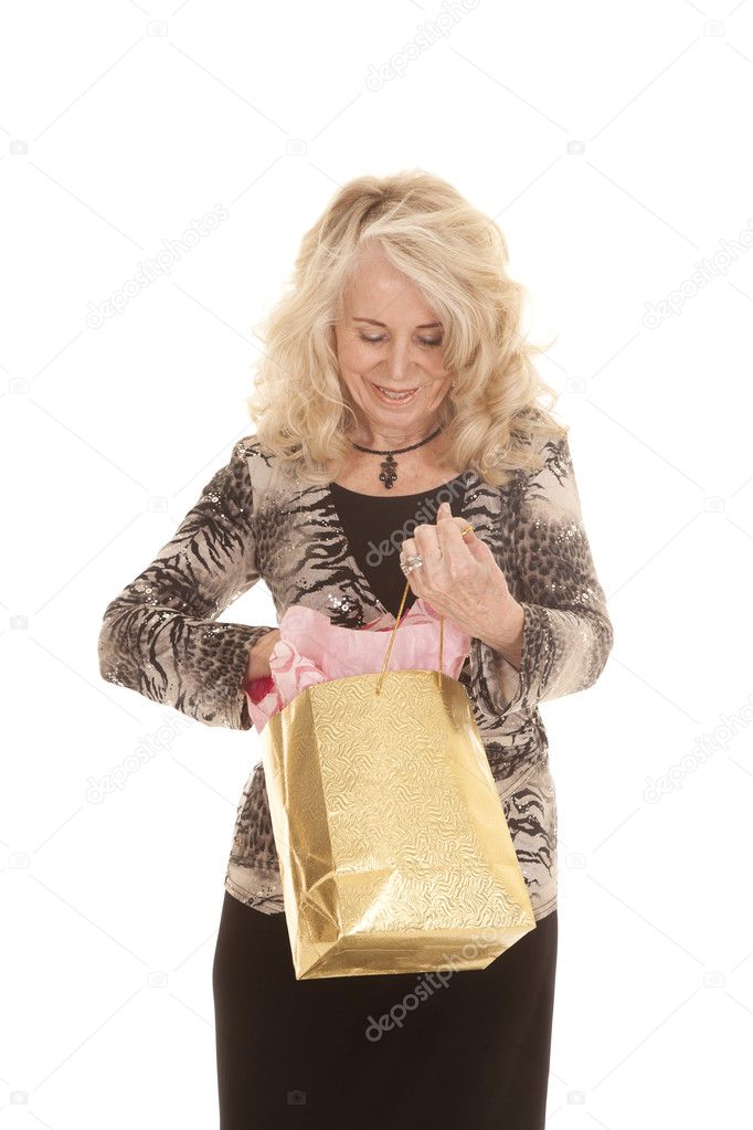 elderly woman looking in bag