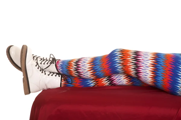 Legs colorful pattern white boots lay — Stock Photo, Image