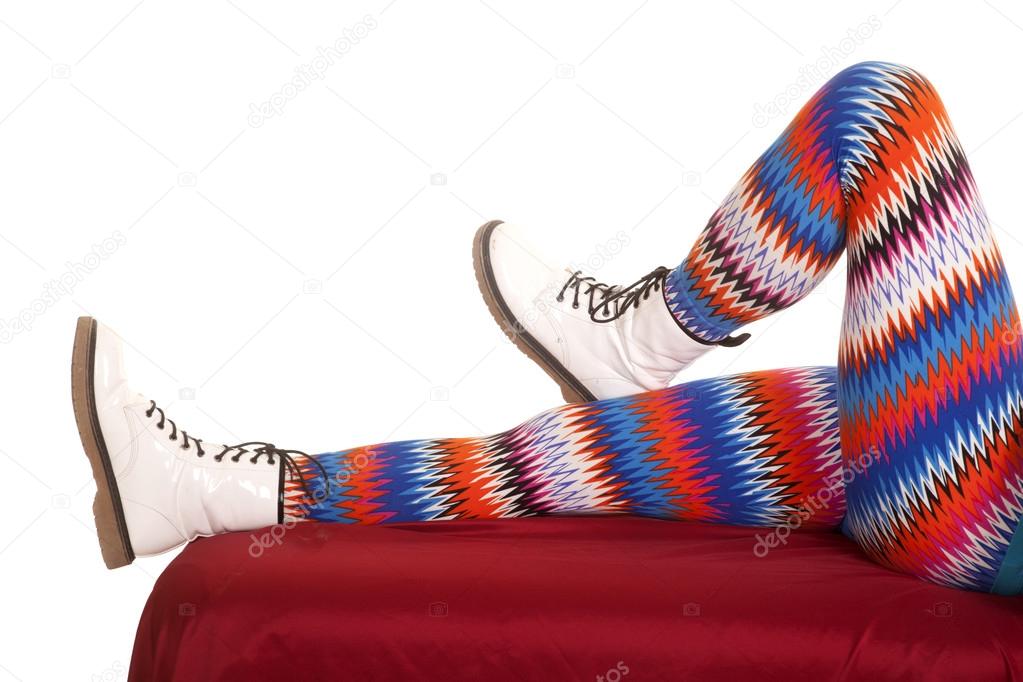 Legs colorful pattern white boots lay one bent