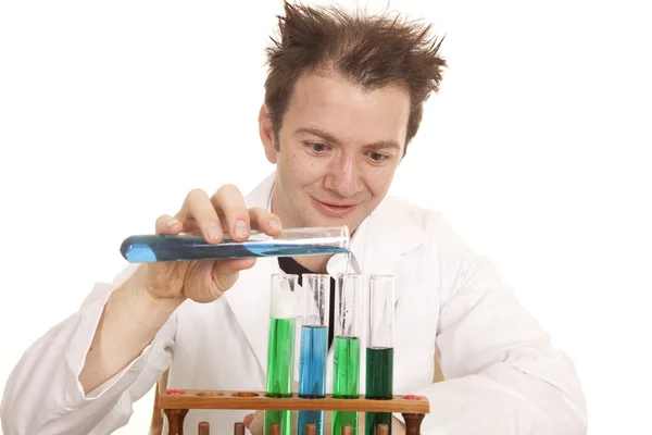 Mad scientist pour blue test tube — Stock Photo, Image