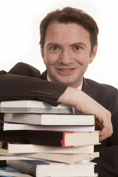 Hombre traje libros cerrar buscando — Foto de Stock