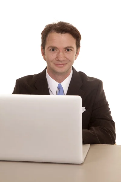 Man at computer smile Stock Picture