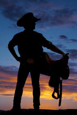 Silhouette of cowboy, saddle clipart