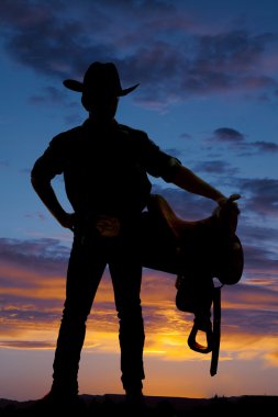Silhouette of cowboy, saddle clipart