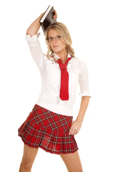 School girl red skirt book hold over head — Stock Photo, Image