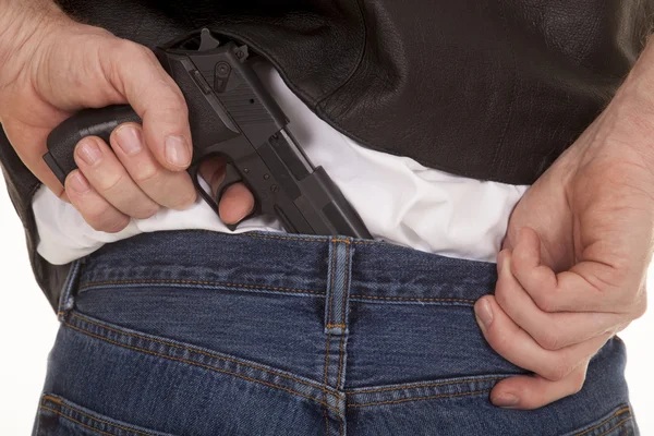 Pull gun out of pants — Stock Photo, Image