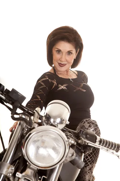 Older woman on motorcycle close smile — Stock Photo, Image