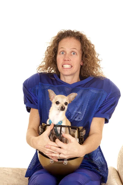 Woman football player. dog in helmet — Stock Photo, Image
