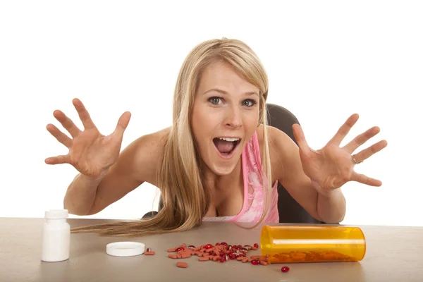 Woman pink tank top pills excited — Stock Photo, Image
